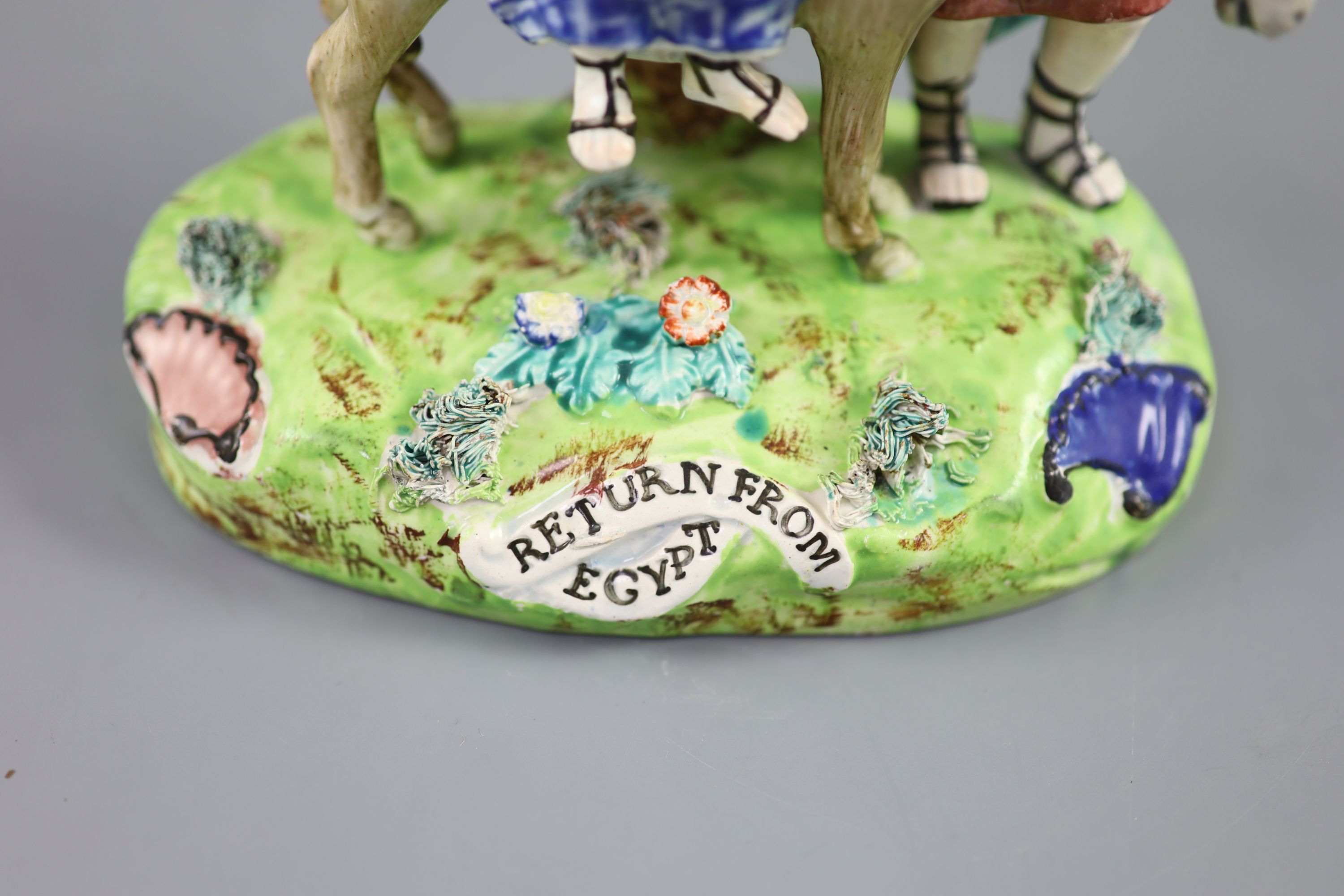 A John Walton of Burslem pearlware group Return from Egypt, 20cm high